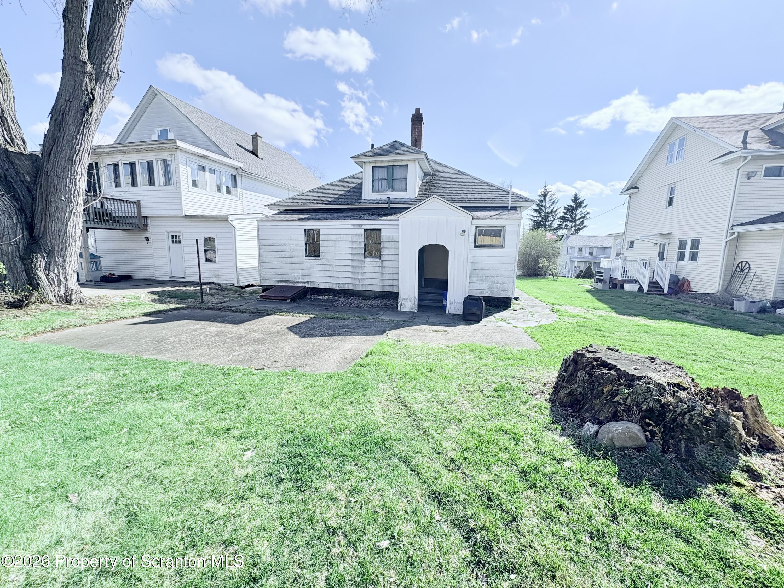 1922 Lafayette Street Scranton, PA 18504 - Photo 3 of 14 a front view of a house with a yard and garage