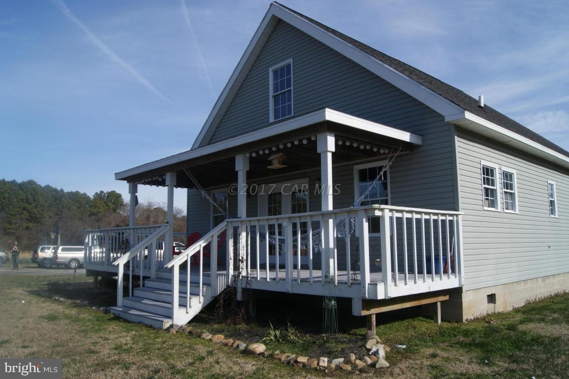 10995 Roland Parks Road Deal Island, MD 21821 - Photo 2 of 30 a view of a house with a deck