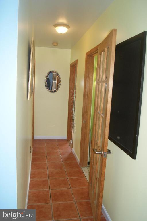 10995 Roland Parks Road Deal Island, MD 21821 - Photo 15 of 30 a view of a bathroom with door