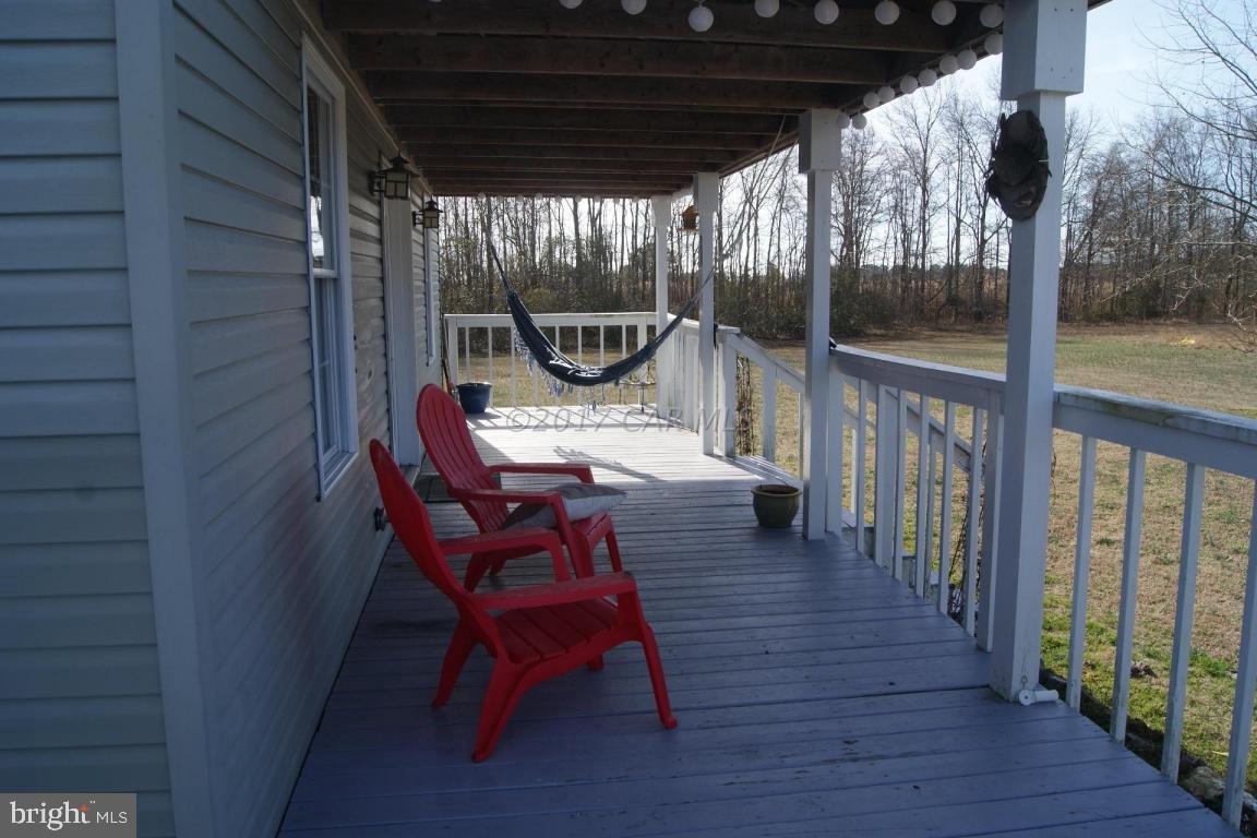 10995 Roland Parks Road Deal Island, MD 21821 - Photo 3 of 30 a view of a porch with furniture