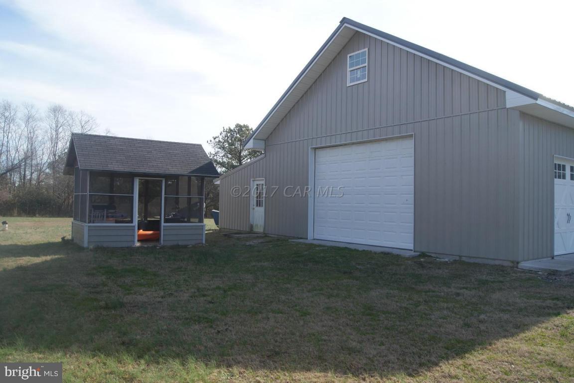 10995 Roland Parks Road Deal Island, MD 21821 - Photo 21 of 30 a front view of a house with a yard
