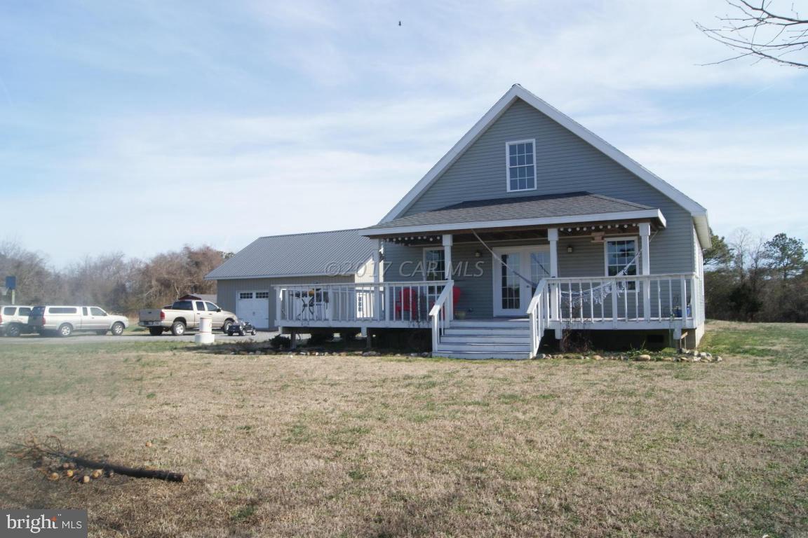 10995 Roland Parks Road Deal Island, MD 21821 - Photo 28 of 30 a front view of a house with a yard and garage