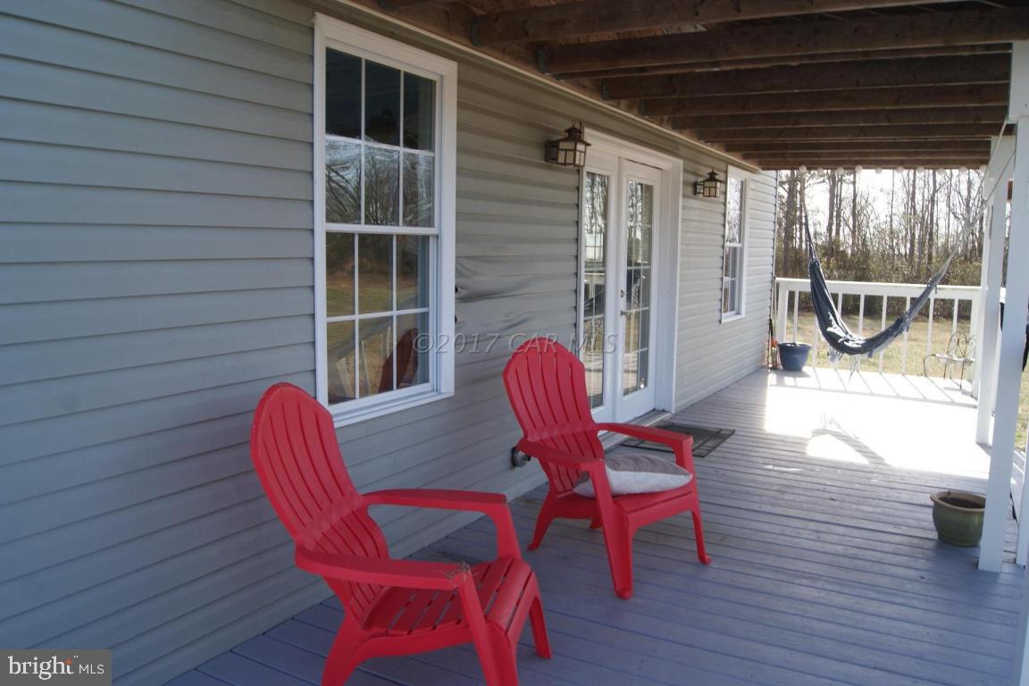 10995 Roland Parks Road Deal Island, MD 21821 - Photo 4 of 30 a outdoor dining space with furniture