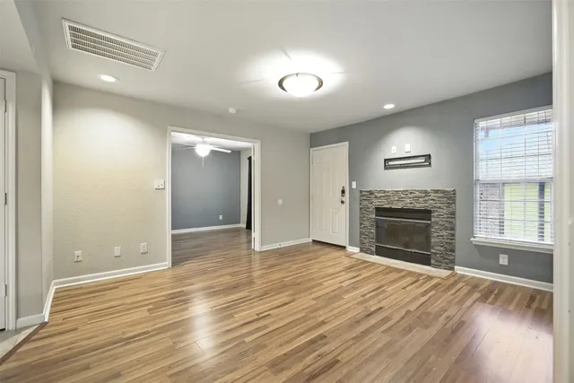 a view of kitchen with refrigerator and window