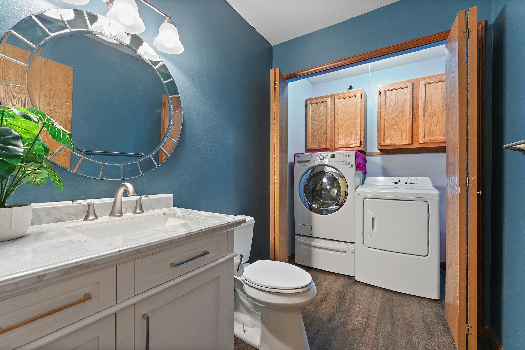 505 Wesley Road Kouts, IN 46347 - Photo 16 of 36 a bathroom with a sink a toilet and a mirror