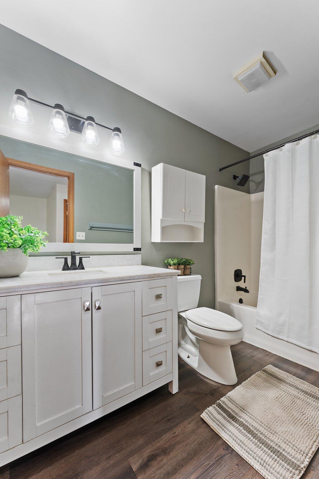 505 Wesley Road Kouts, IN 46347 - Photo 19 of 36 a bathroom with a double vanity sink mirror and toilet