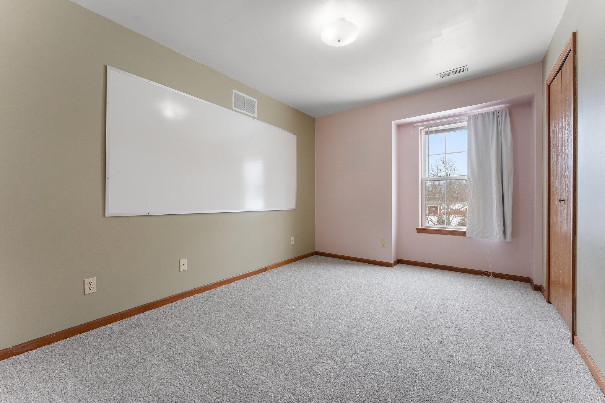 505 Wesley Road Kouts, IN 46347 - Photo 20 of 36 an empty room with windows and closet