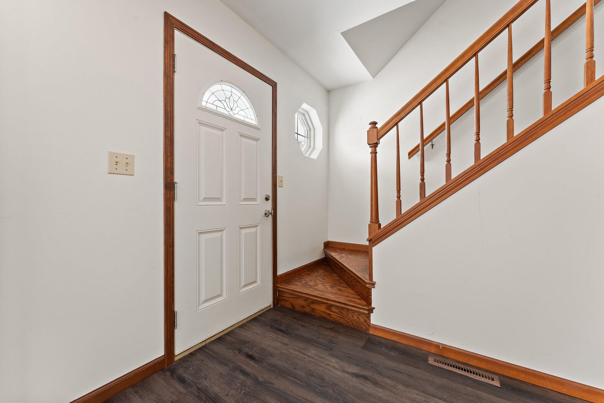 505 Wesley Road Kouts, IN 46347 - Photo 3 of 36 a view of an entryway with wooden floor