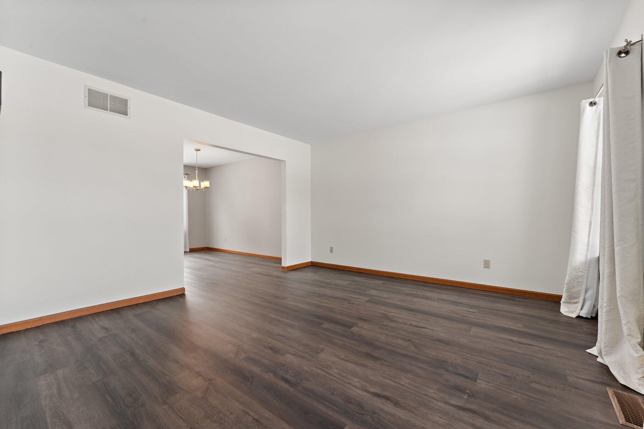 505 Wesley Road Kouts, IN 46347 - Photo 5 of 36 a view of an empty room with wooden floor and closet