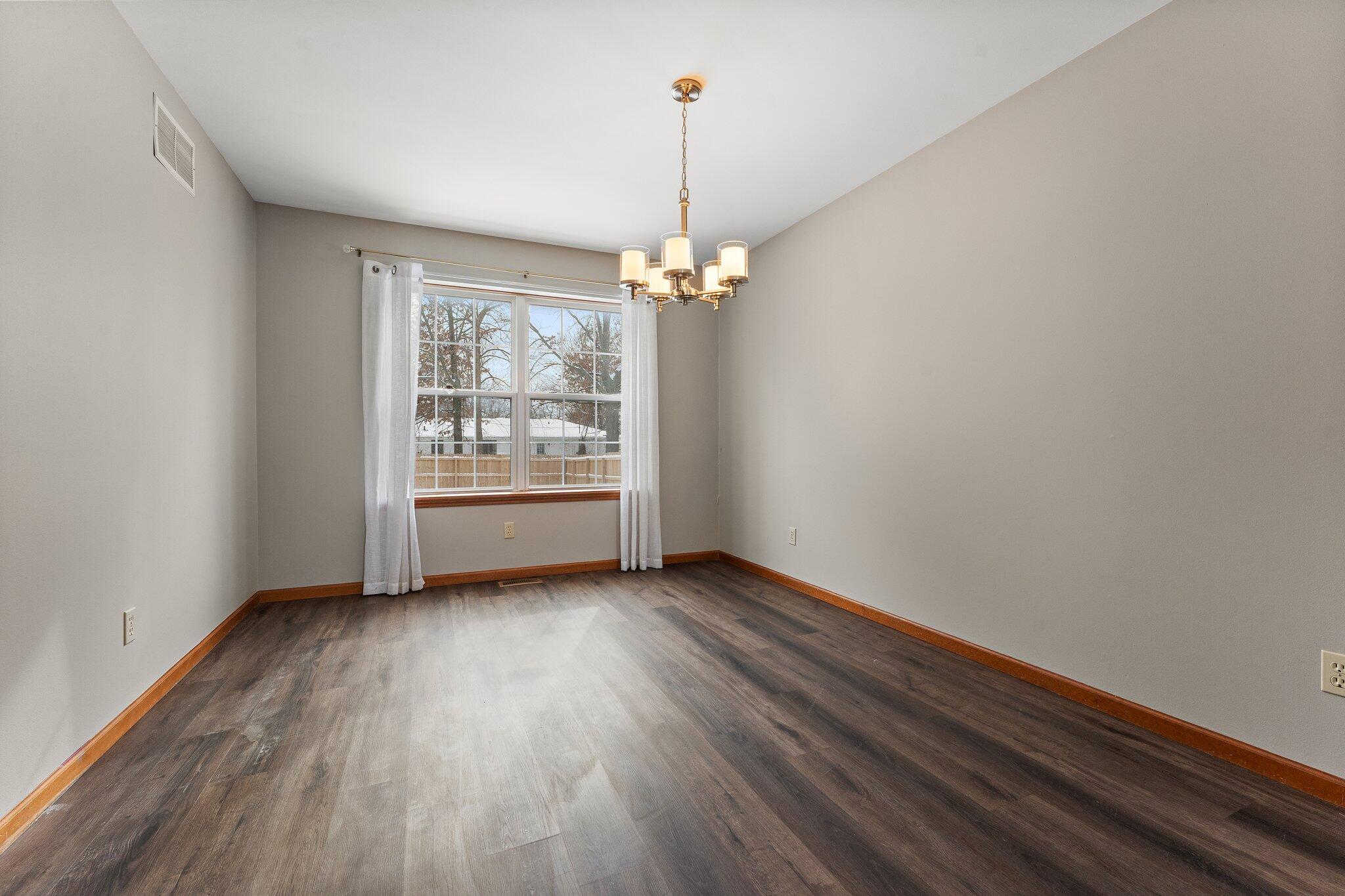 505 Wesley Road Kouts, IN 46347 - Photo 7 of 36 a view of a room with wooden floor closet and windows