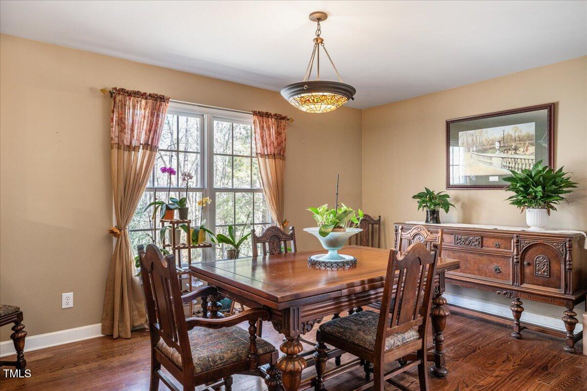 348 Raymond Tharrington Road Louisburg, NC 27549 - Photo 22 of 47 a view of a dining room with furniture window and wooden floor