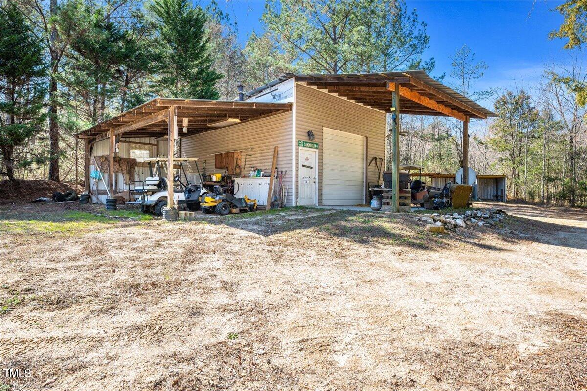 348 Raymond Tharrington Road Louisburg, NC 27549 - Photo 44 of 47 a view of a house with backyard porch and sitting area