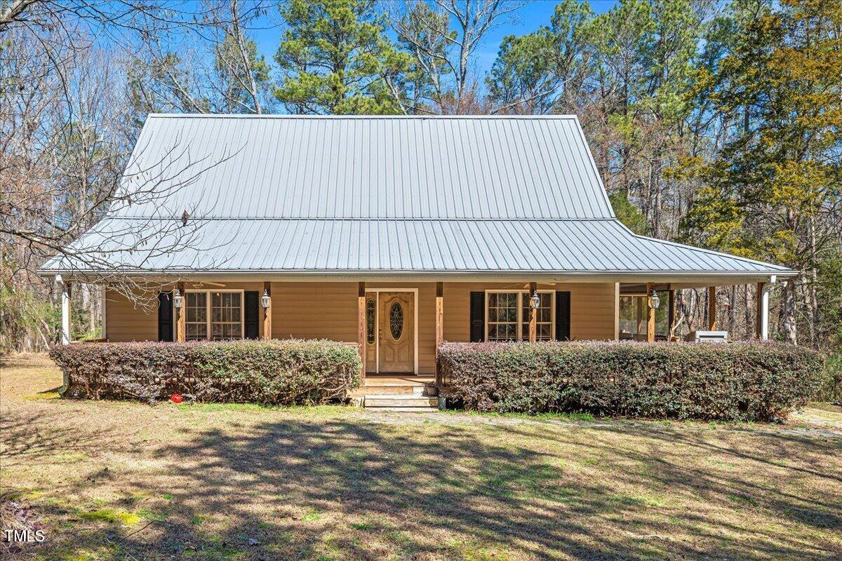 348 Raymond Tharrington Road Louisburg, NC 27549 - Photo 3 of 47 front view of a house