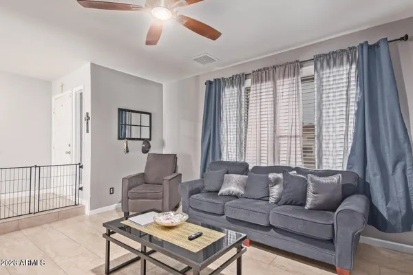 a living room with furniture and a large window