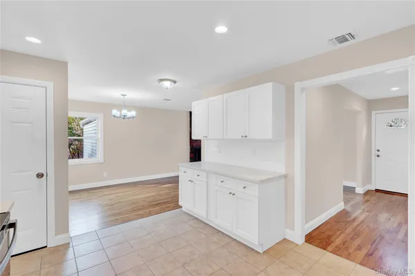 a view of kitchen with wooden floor