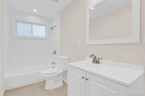 a bathroom with a sink a toilet and a bathtub