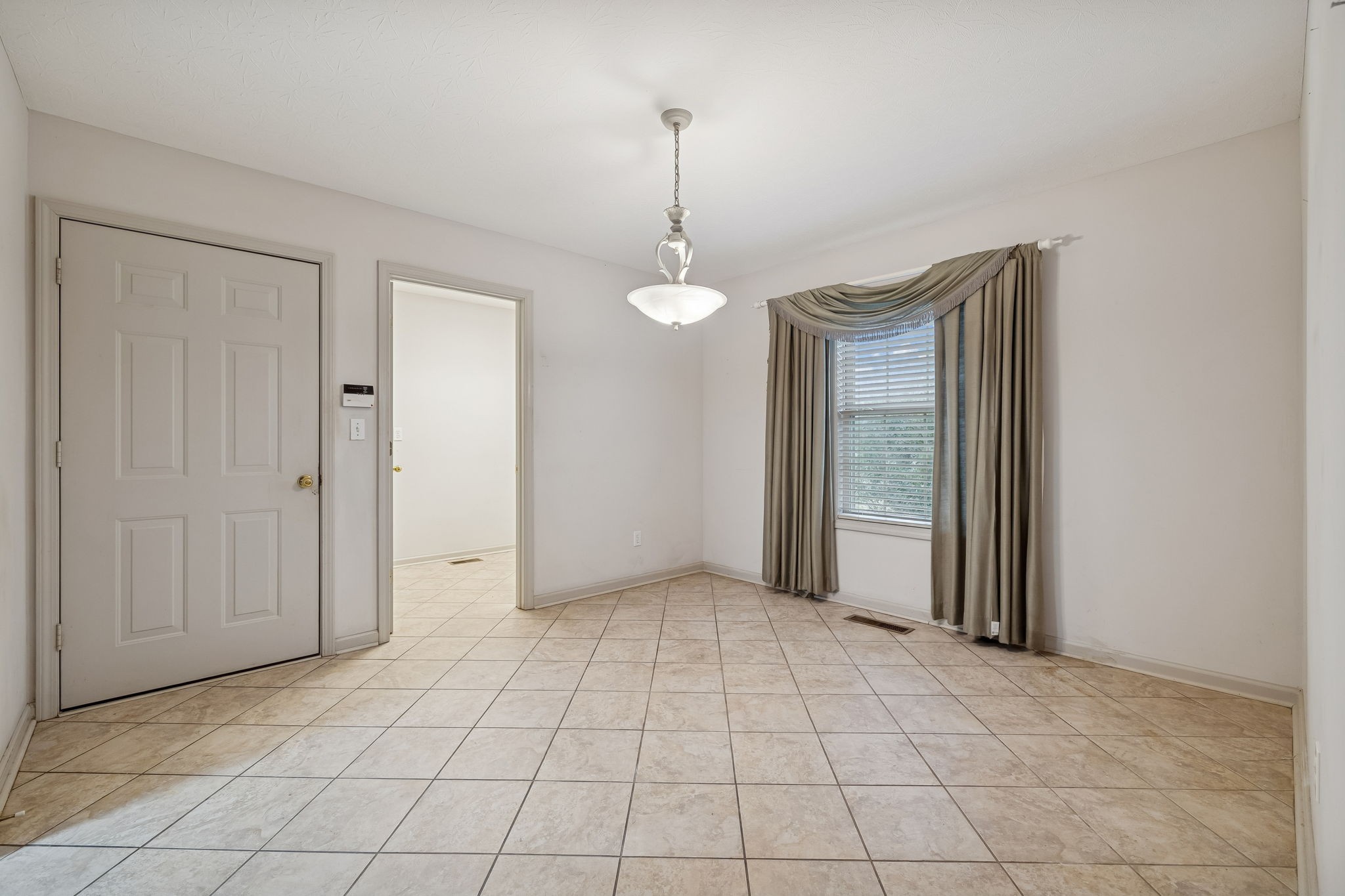 788 Long Creek Road Lafayette, TN 37083 - Photo 13 of 32 a view of a room with a chandelier fan and windows