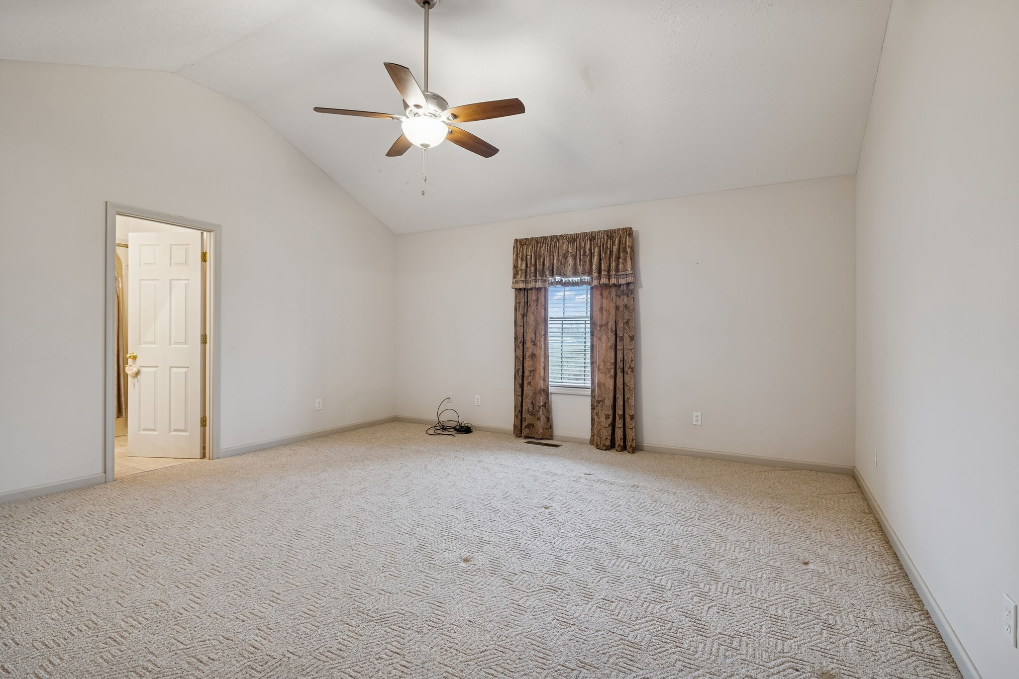 788 Long Creek Road Lafayette, TN 37083 - Photo 16 of 32 an empty room with fan