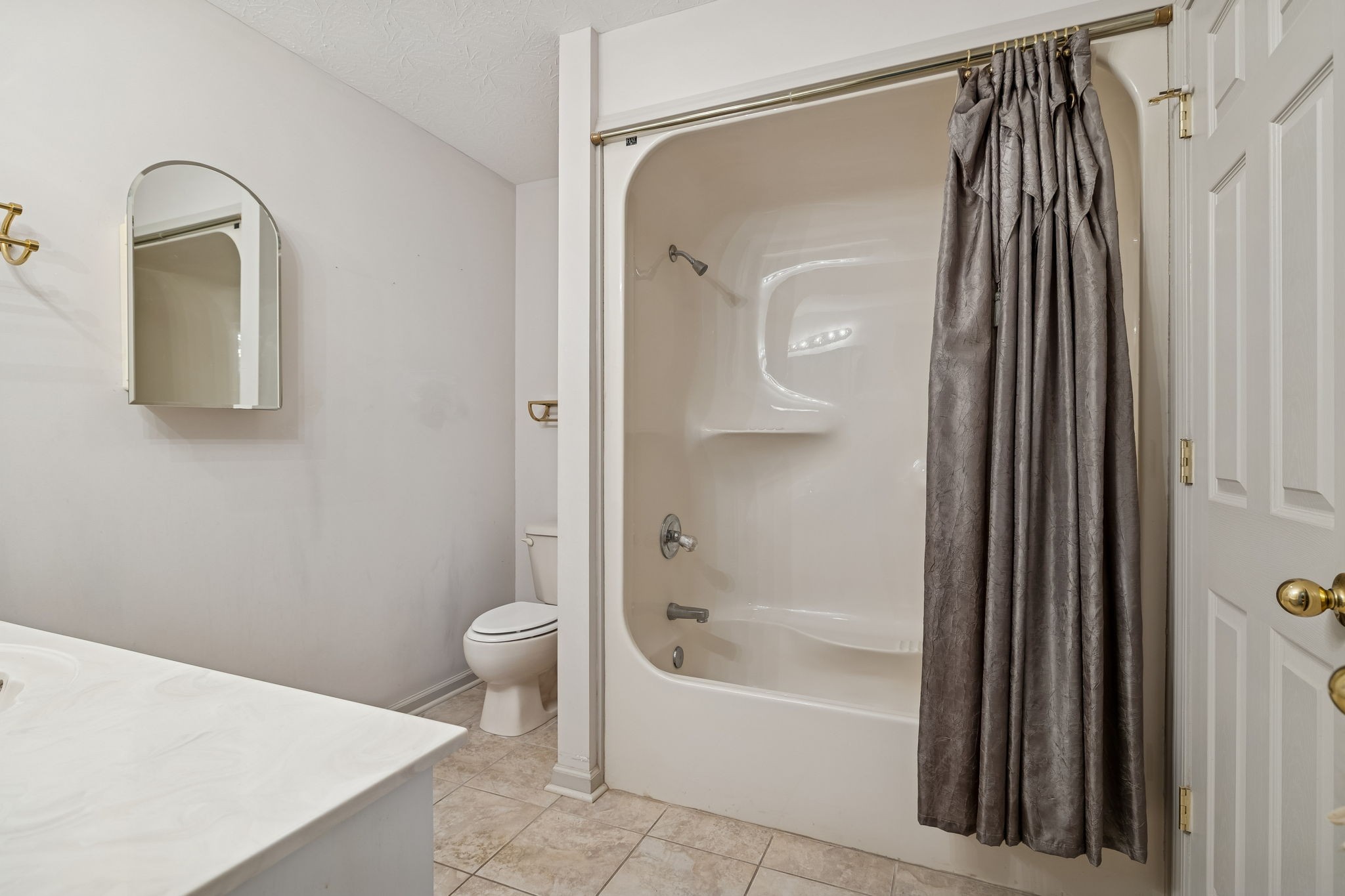 788 Long Creek Road Lafayette, TN 37083 - Photo 18 of 32 a bathroom with a bathtub and a shower