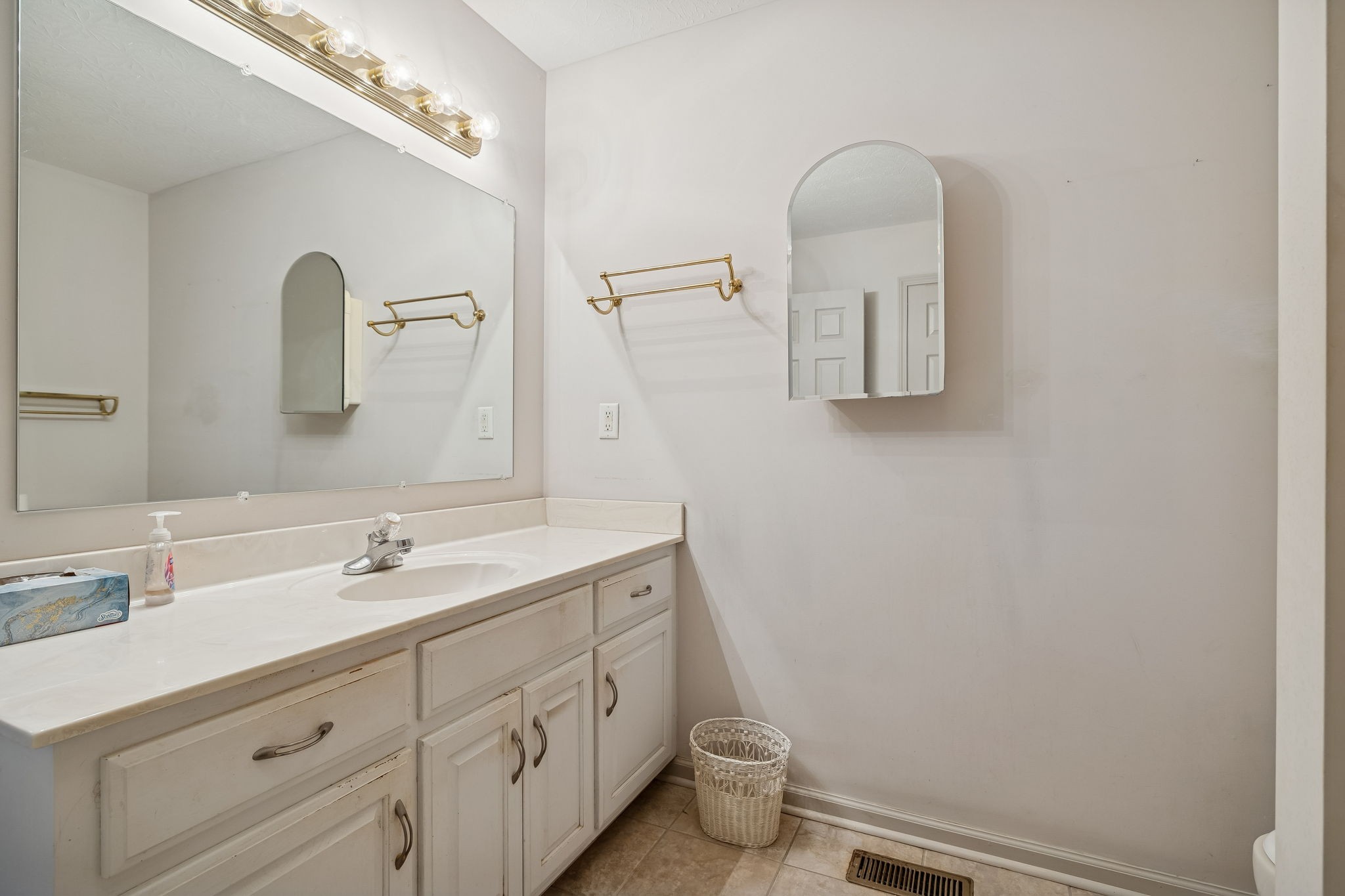 788 Long Creek Road Lafayette, TN 37083 - Photo 19 of 32 a bathroom with a double vanity sink and mirror