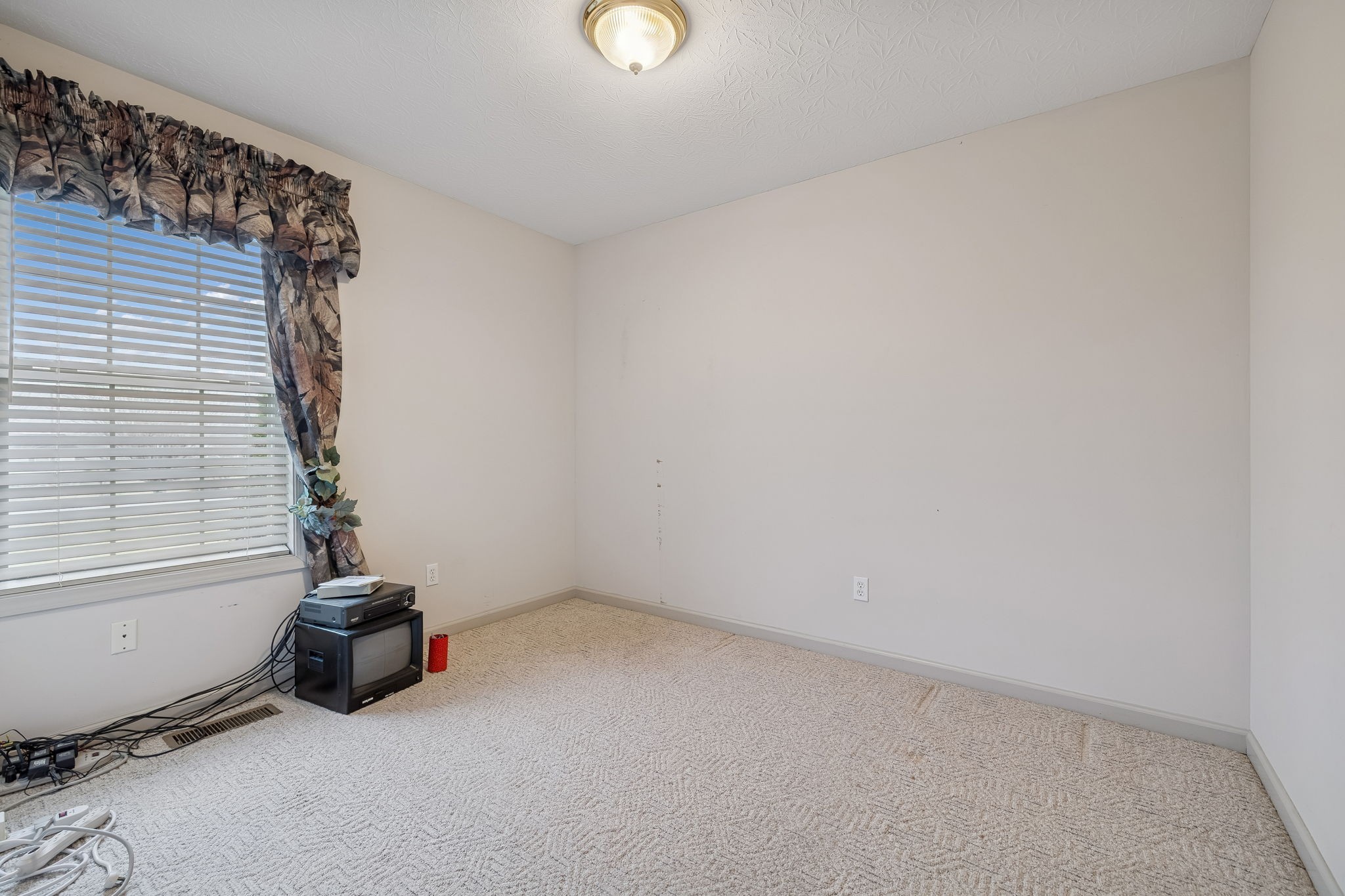 788 Long Creek Road Lafayette, TN 37083 - Photo 23 of 32 a view of a room with gym equipment and a window