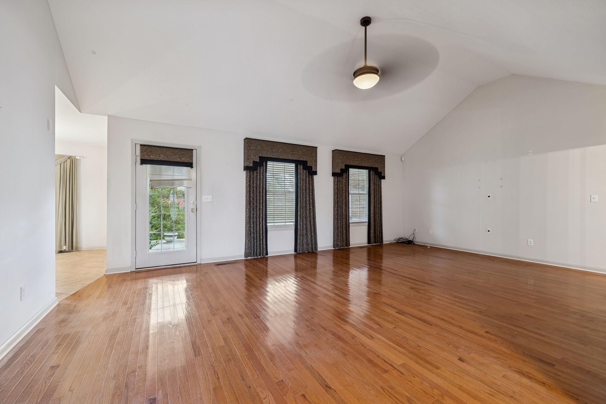 788 Long Creek Road Lafayette, TN 37083 - Photo 6 of 32 a view of an empty room with wooden floor and a window