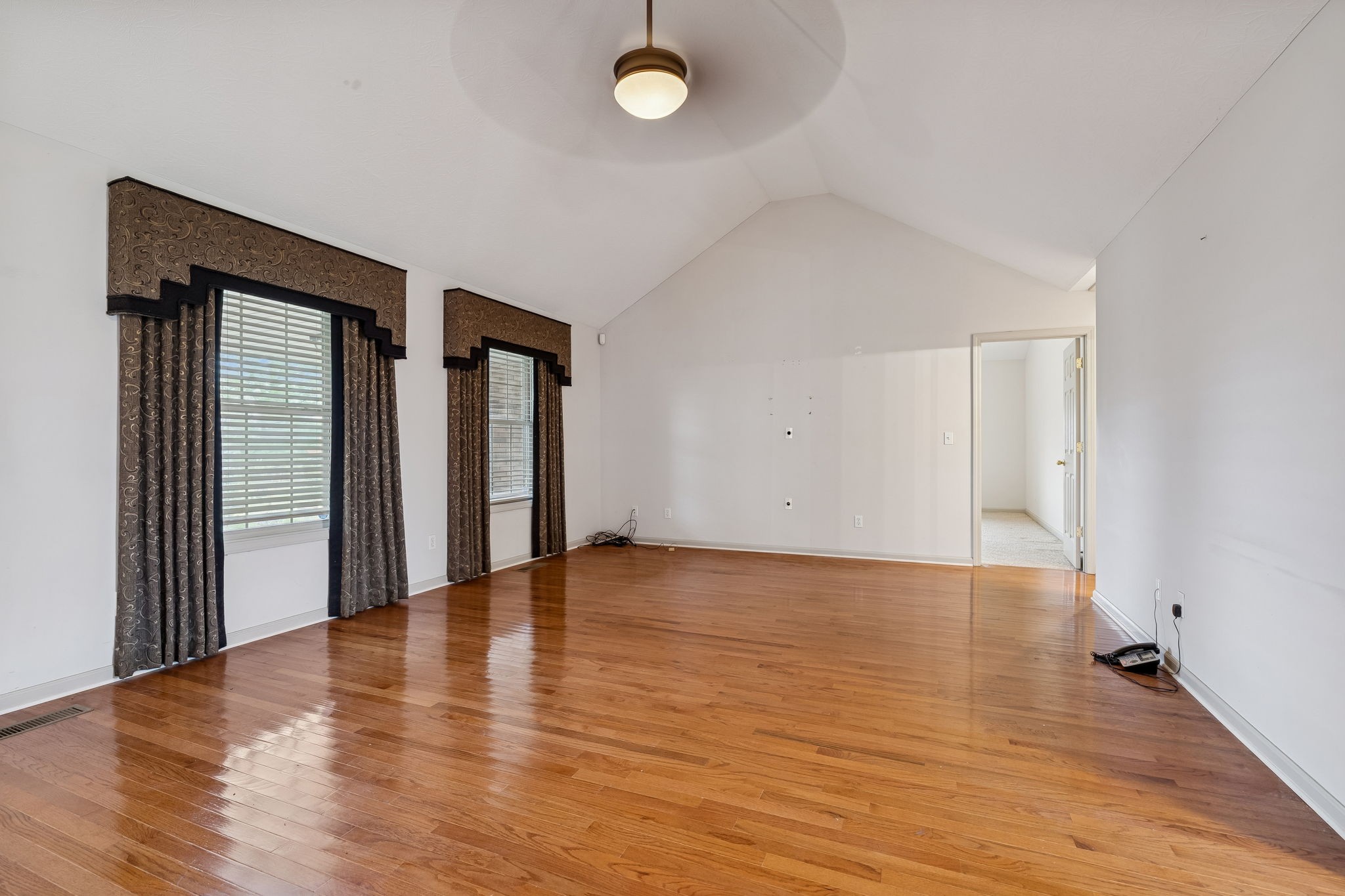 788 Long Creek Road Lafayette, TN 37083 - Photo 7 of 32 a view of an empty room with wooden floor and a window