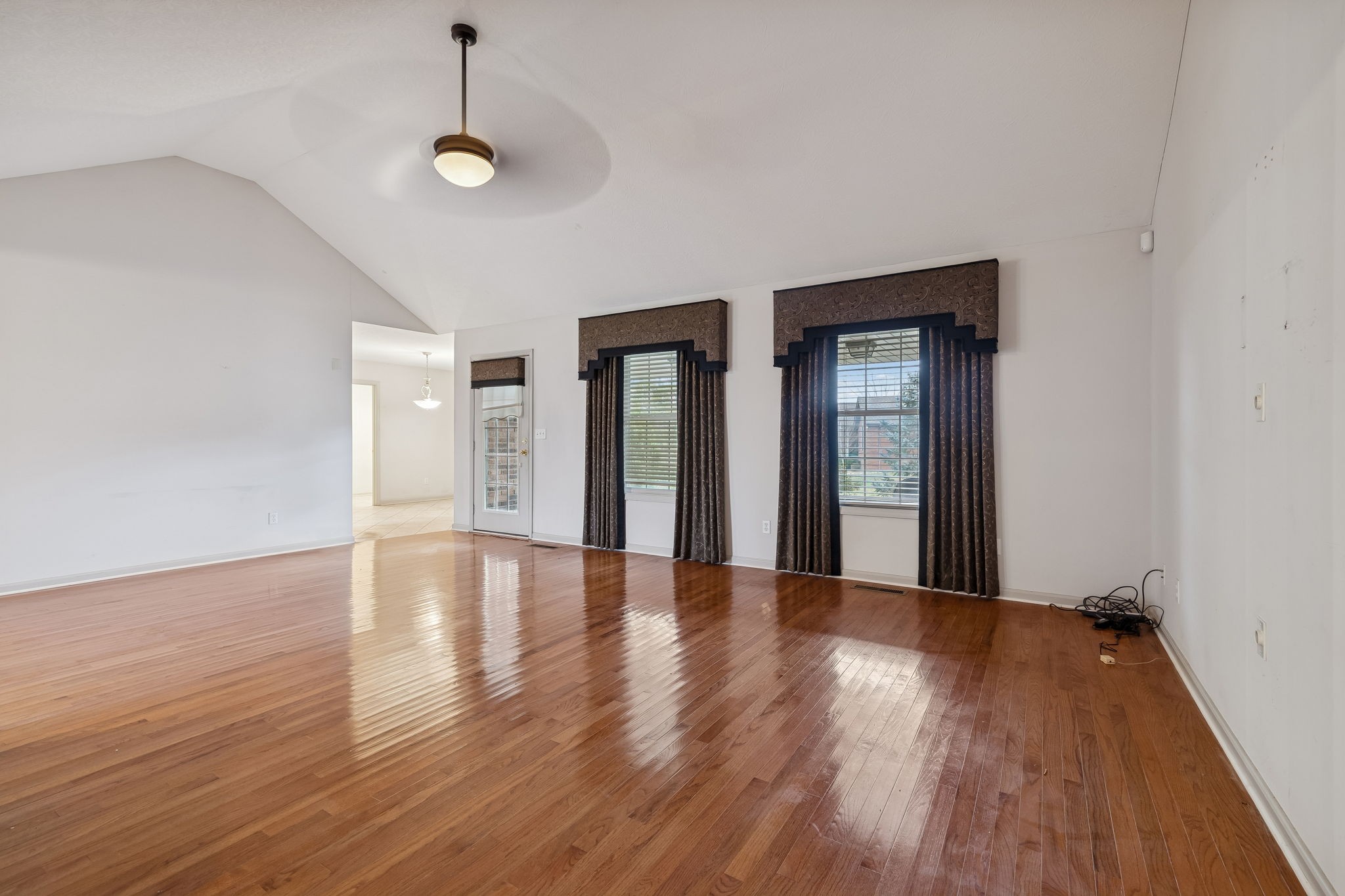 788 Long Creek Road Lafayette, TN 37083 - Photo 10 of 32 a view of an empty room with wooden floor and a window