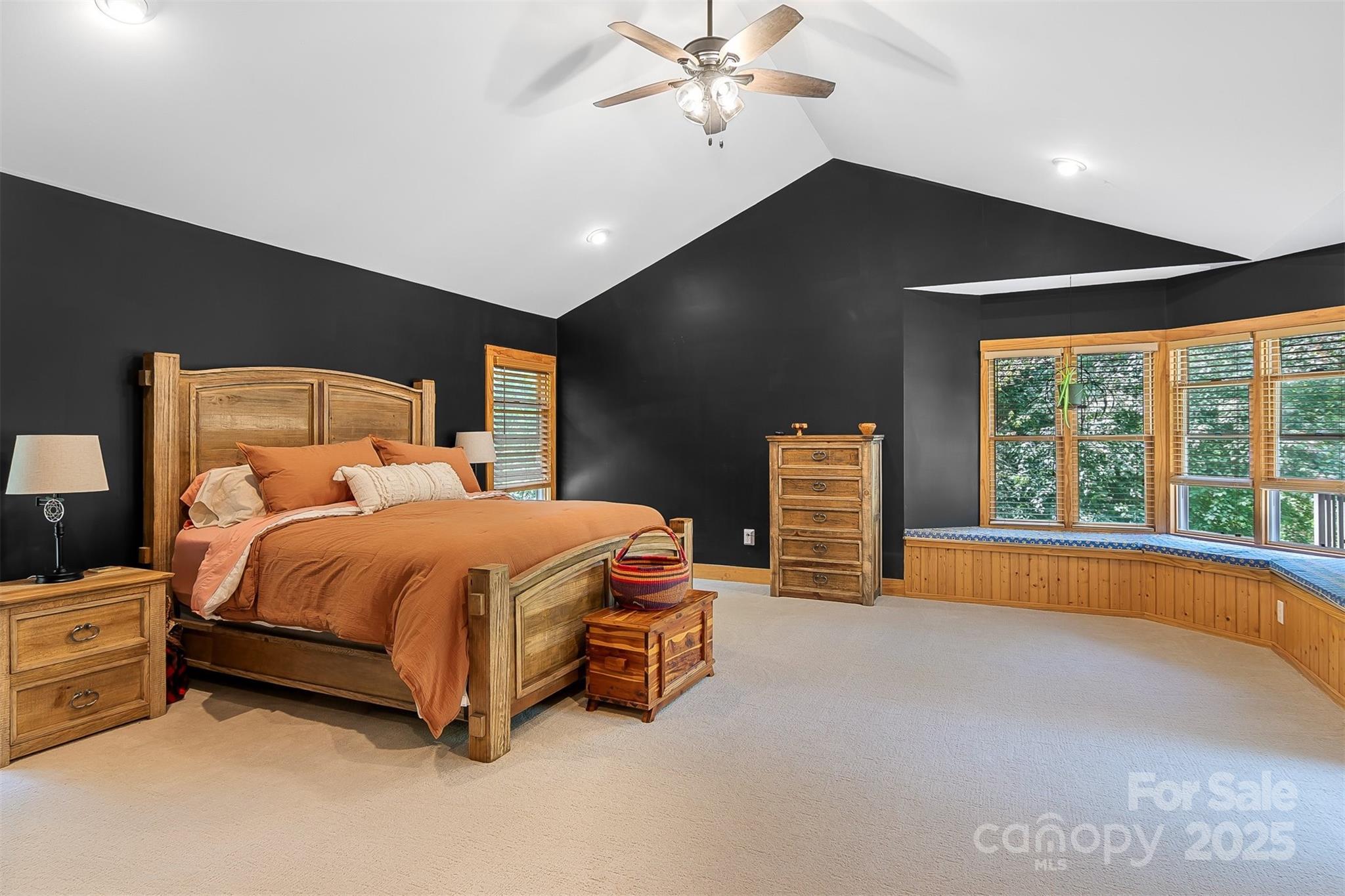5690 Anchor Drive Granite Falls, NC 28630 - Photo 15 of 48 a spacious bedroom with a bed and a chandelier