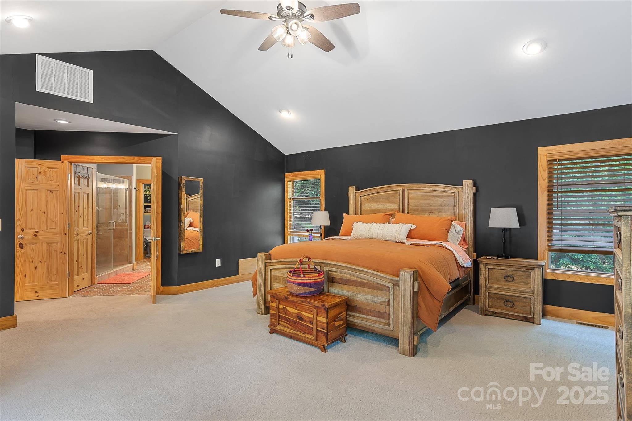 5690 Anchor Drive Granite Falls, NC 28630 - Photo 16 of 48 a spacious bedroom with a bed and a chandelier