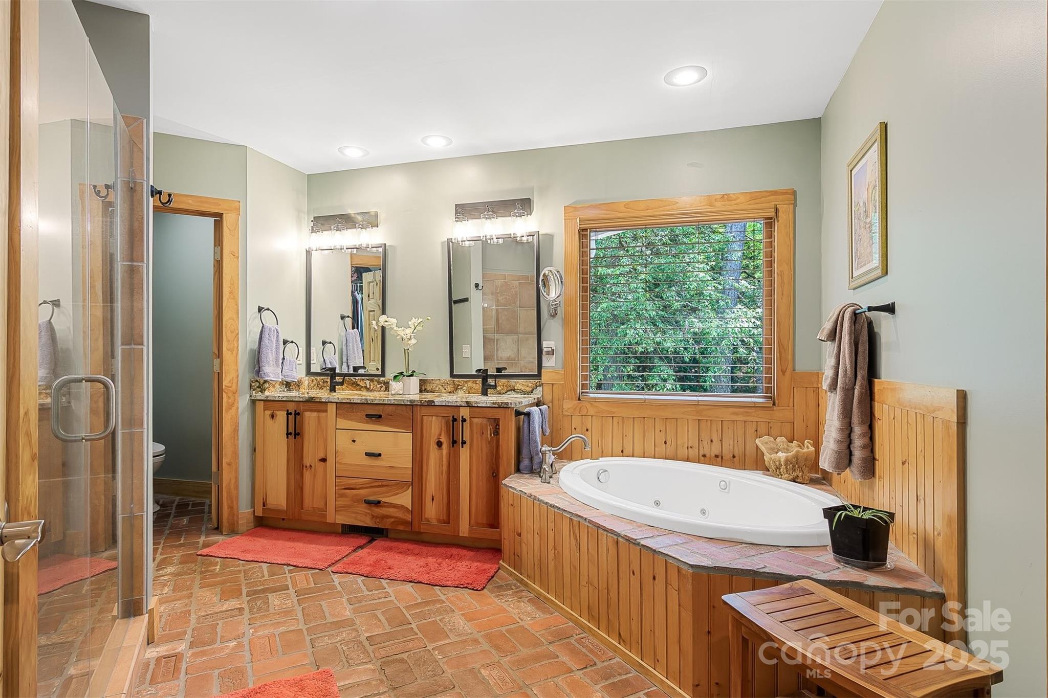 5690 Anchor Drive Granite Falls, NC 28630 - Photo 17 of 48 a bathroom with a tub a sink and a mirror