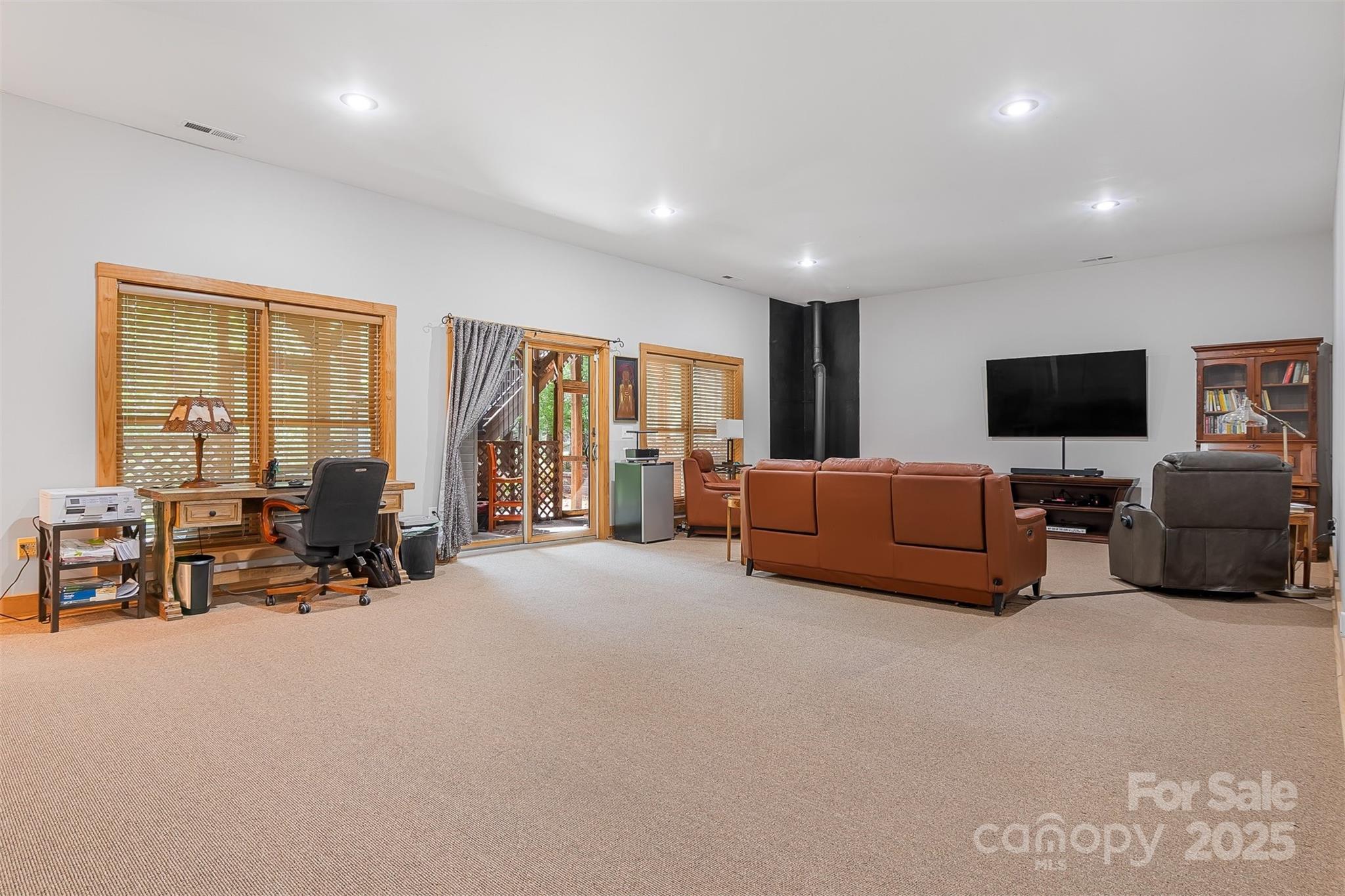 5690 Anchor Drive Granite Falls, NC 28630 - Photo 21 of 48 a living room with furniture and a flat screen tv