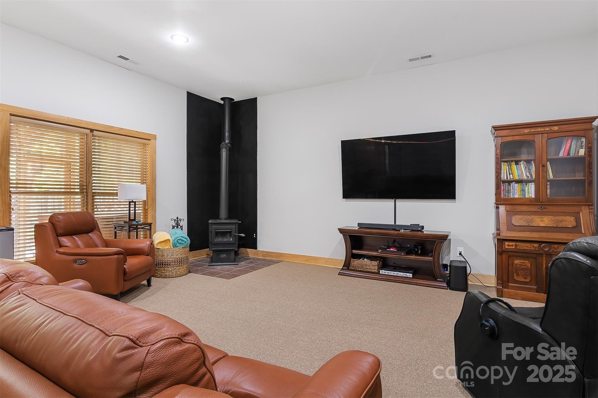 5690 Anchor Drive Granite Falls, NC 28630 - Photo 22 of 48 a living room with furniture and a flat screen tv