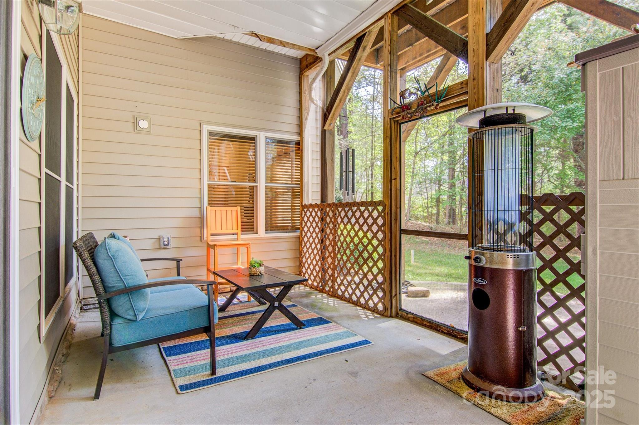 5690 Anchor Drive Granite Falls, NC 28630 - Photo 24 of 48 a living room with furniture and floor to ceiling windows