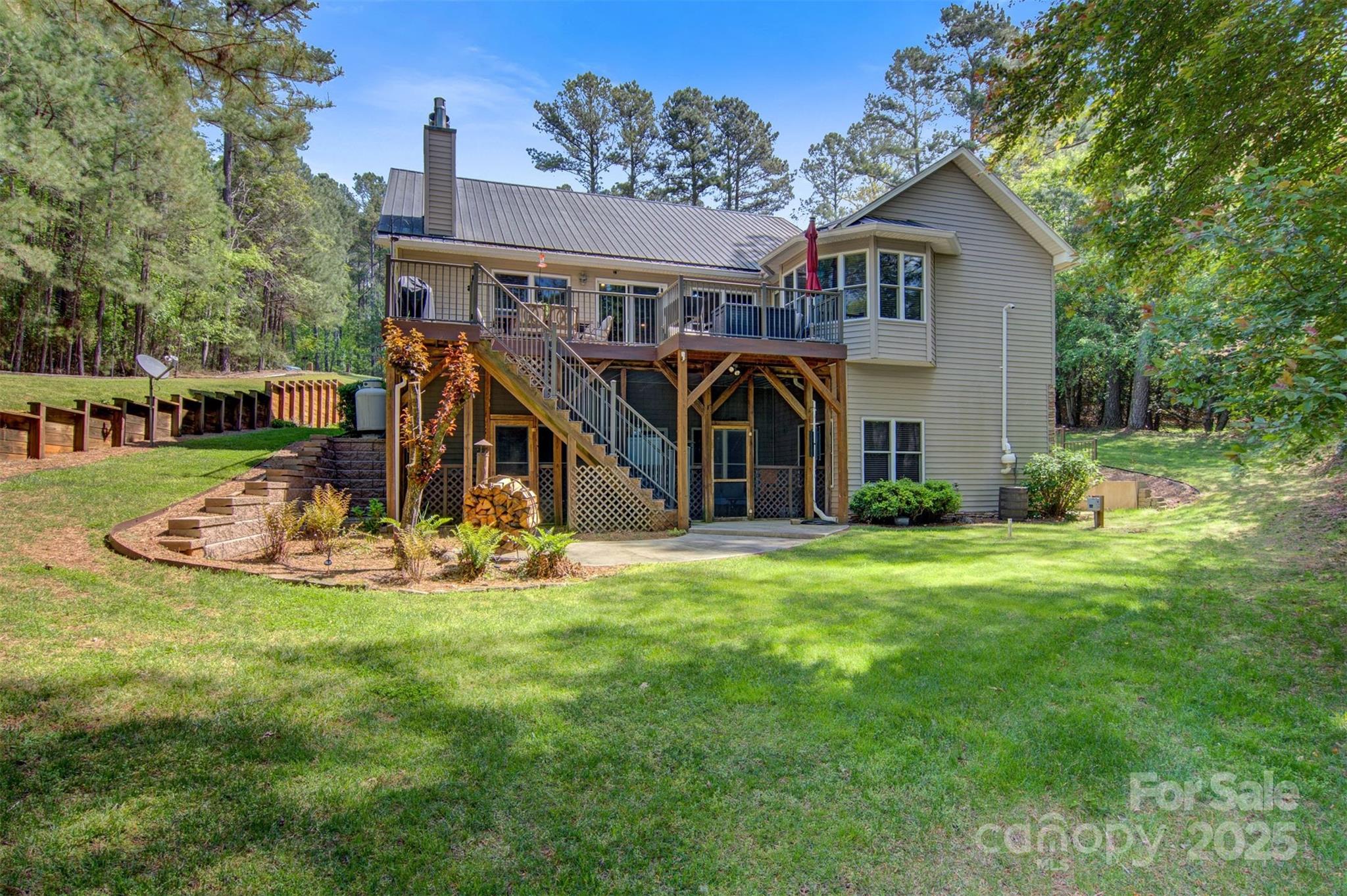 5690 Anchor Drive Granite Falls, NC 28630 - Photo 3 of 48 a view of a house with backyard and sitting area