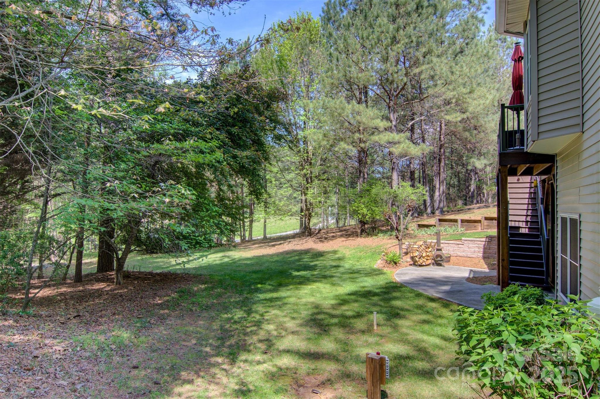 5690 Anchor Drive Granite Falls, NC 28630 - Photo 31 of 48 a view of a backyard with large trees