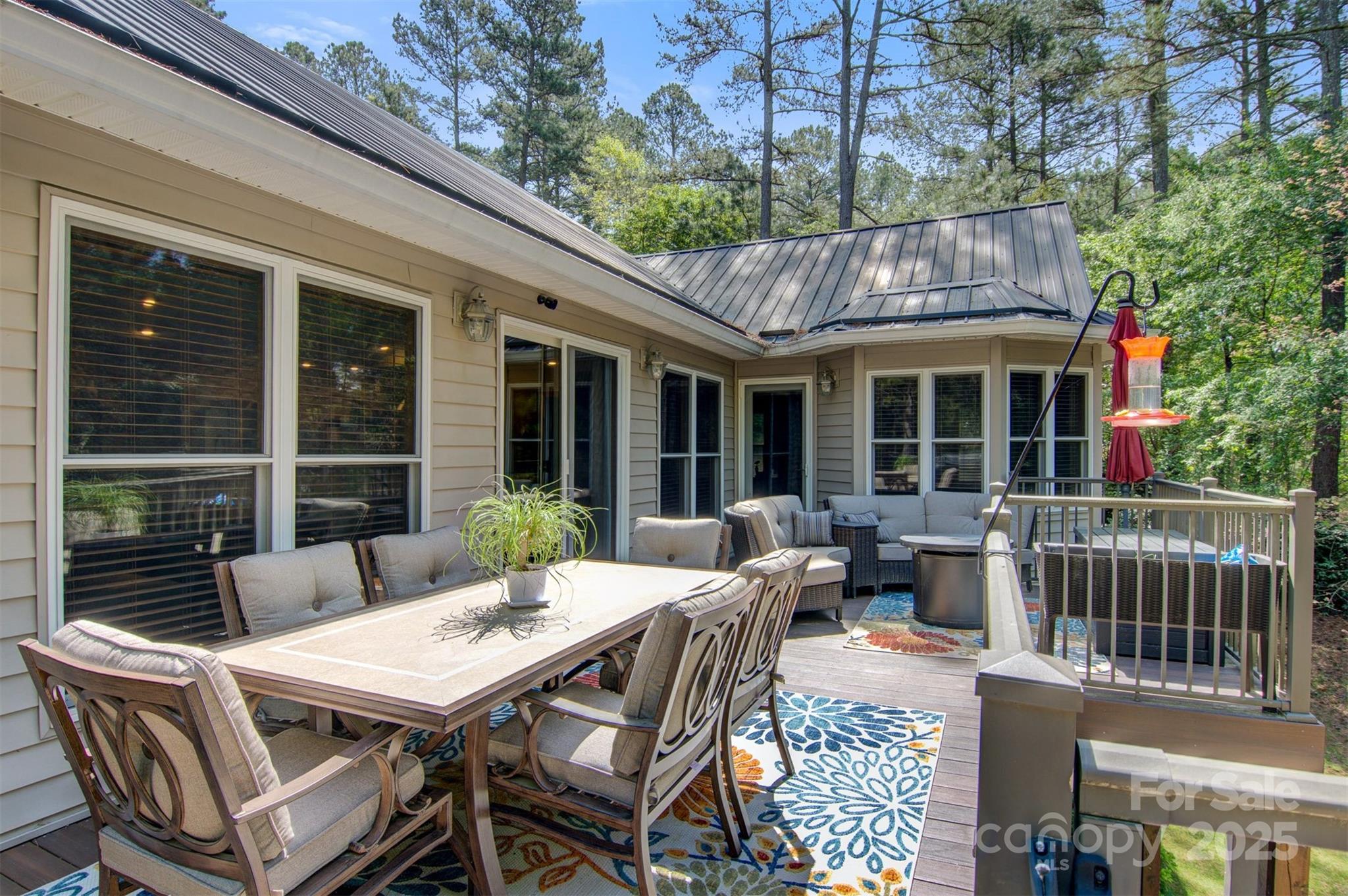 5690 Anchor Drive Granite Falls, NC 28630 - Photo 32 of 48 a view of a patio with a table chairs and a potted plant
