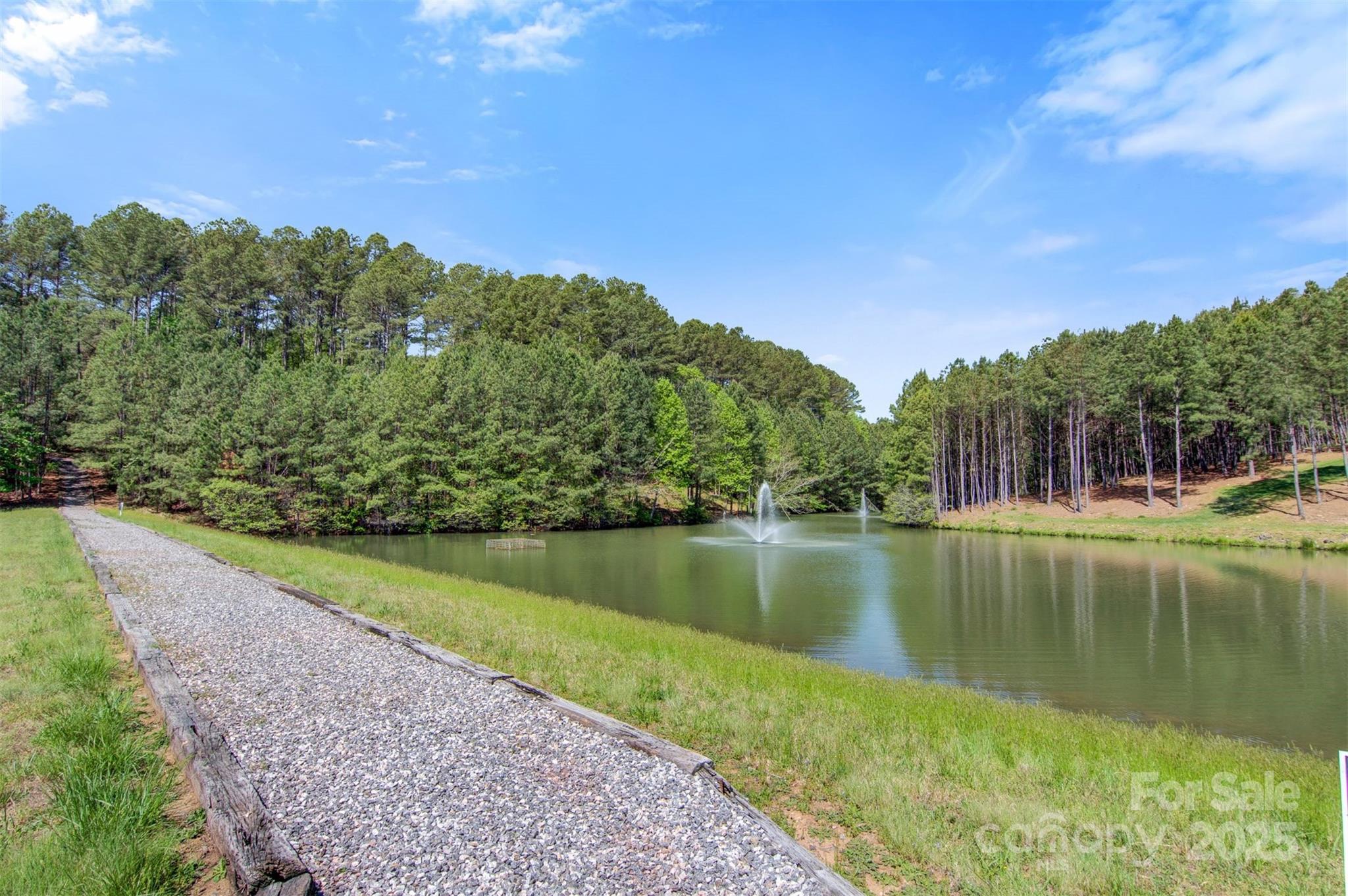 5690 Anchor Drive Granite Falls, NC 28630 - Photo 34 of 48 a view of a lake with a yard