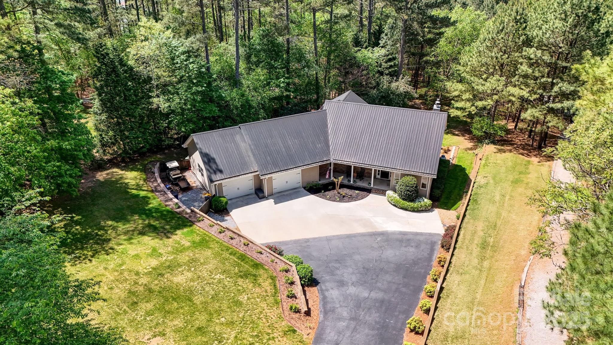 5690 Anchor Drive Granite Falls, NC 28630 - Photo 40 of 48 an aerial view of a house with swimming pool and large trees