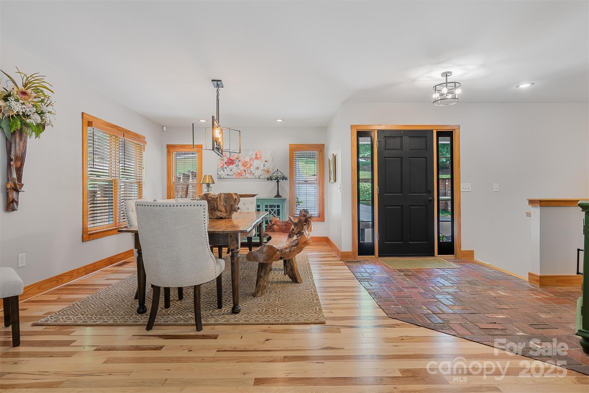5690 Anchor Drive Granite Falls, NC 28630 - Photo 6 of 48 a dining room with furniture a chandelier and wooden floor
