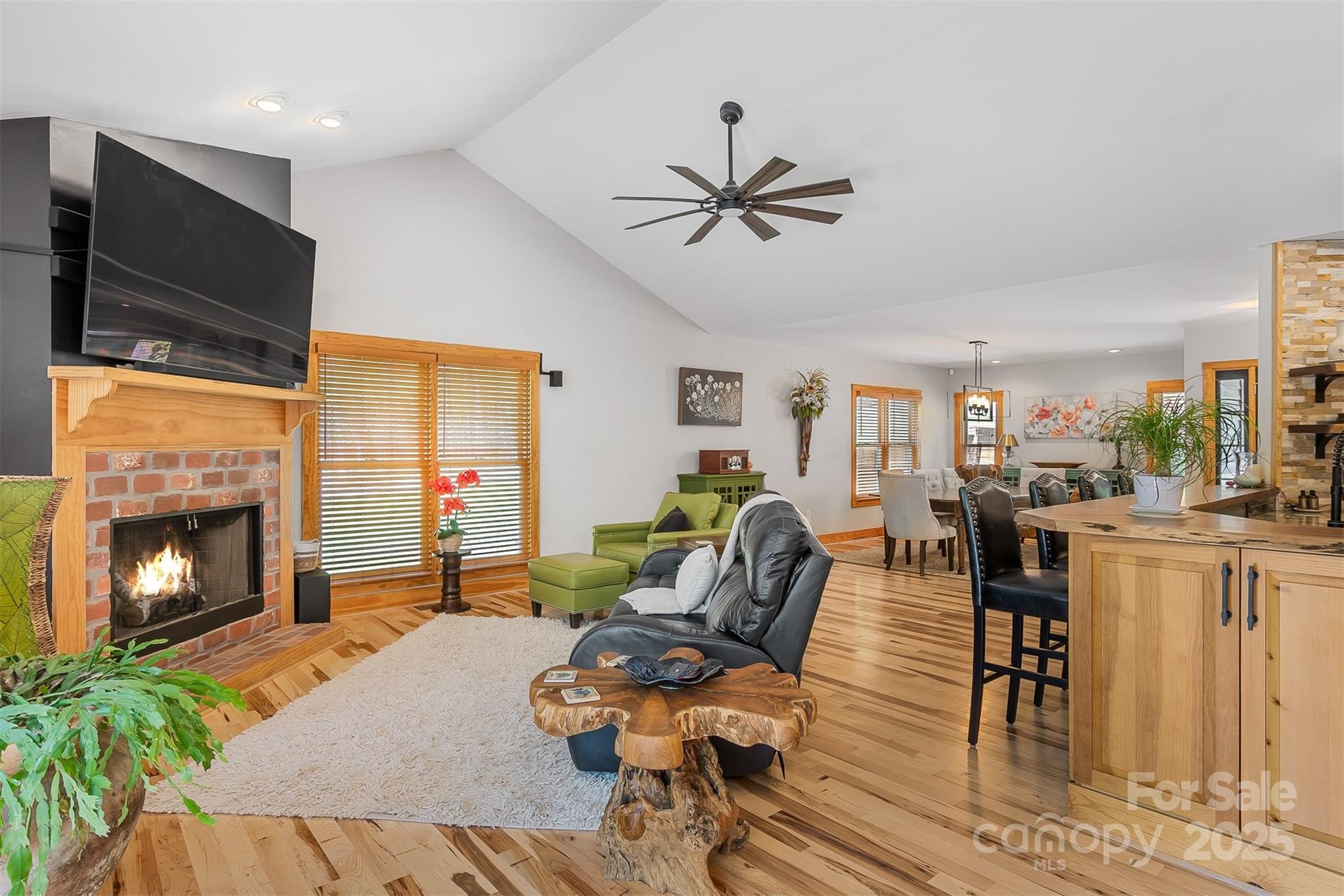 5690 Anchor Drive Granite Falls, NC 28630 - Photo 9 of 48 a living room with furniture fireplace and flat screen tv