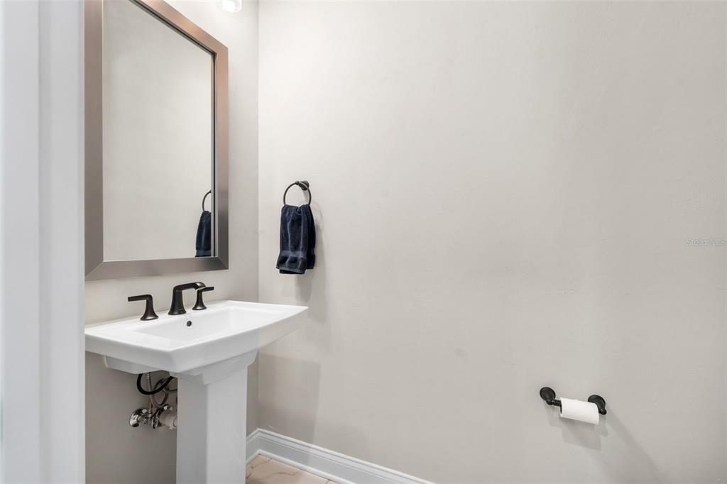 10778 Southwest 34th Road Gainesville, FL 32608 - Photo 21 of 55 a bathroom with a sink and a mirror
