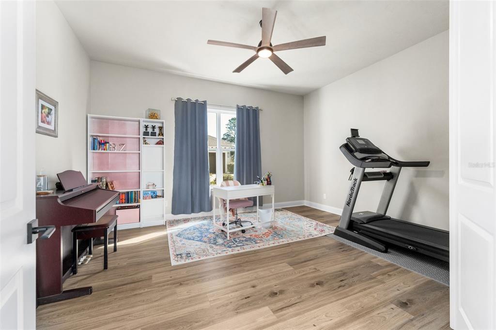 10778 Southwest 34th Road Gainesville, FL 32608 - Photo 24 of 62 a view of a workspace with furniture and a window
