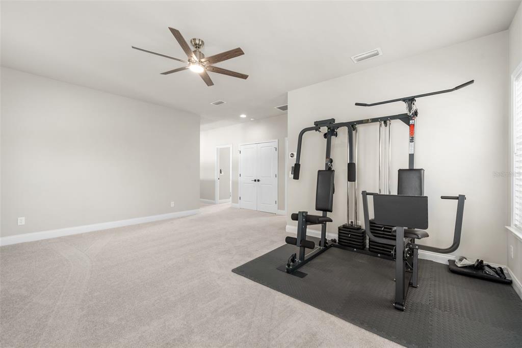 10778 Southwest 34th Road Gainesville, FL 32608 - Photo 31 of 62 a view of a room with gym equipment
