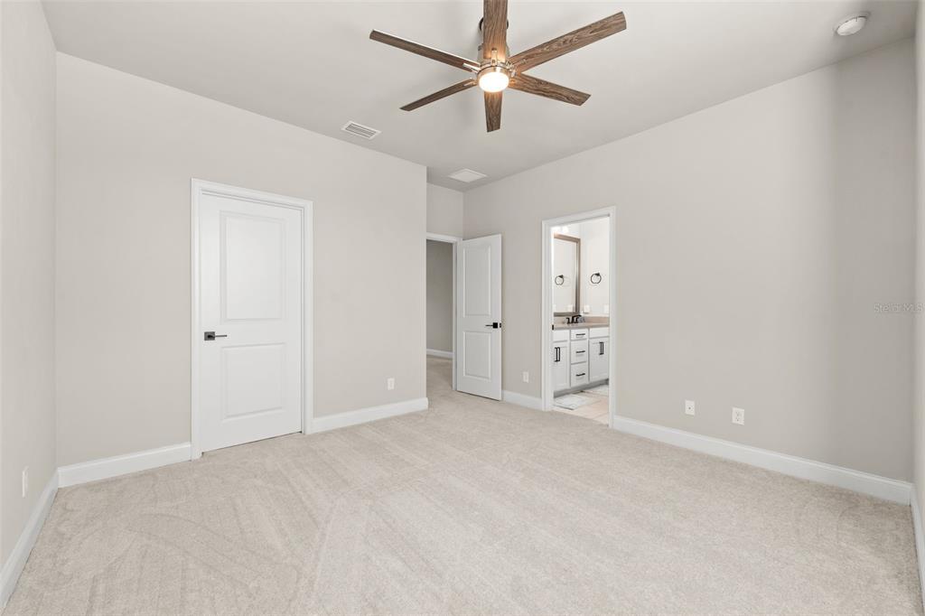 10778 Southwest 34th Road Gainesville, FL 32608 - Photo 32 of 62 an empty room with fan and windows