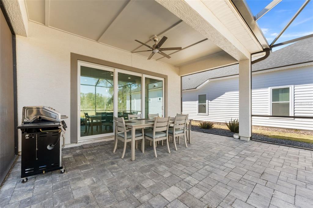 10778 Southwest 34th Road Gainesville, FL 32608 - Photo 43 of 62 a dining room with furniture and a floor to ceiling window