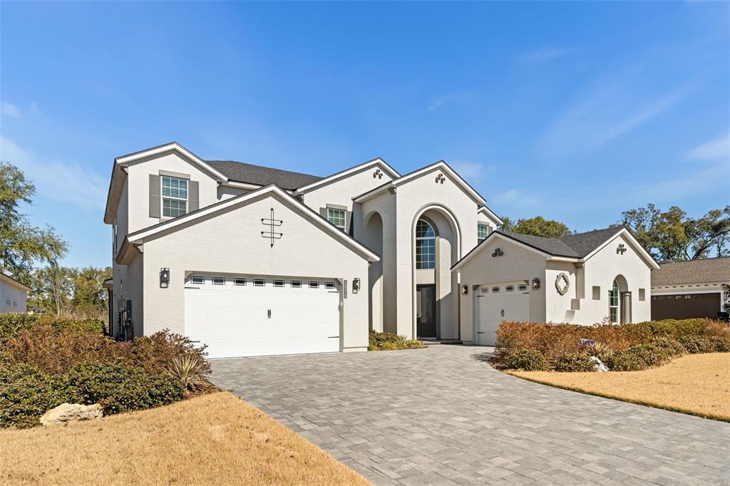 10778 Southwest 34th Road Gainesville, FL 32608 - Photo 47 of 62 a front view of a house with a yard