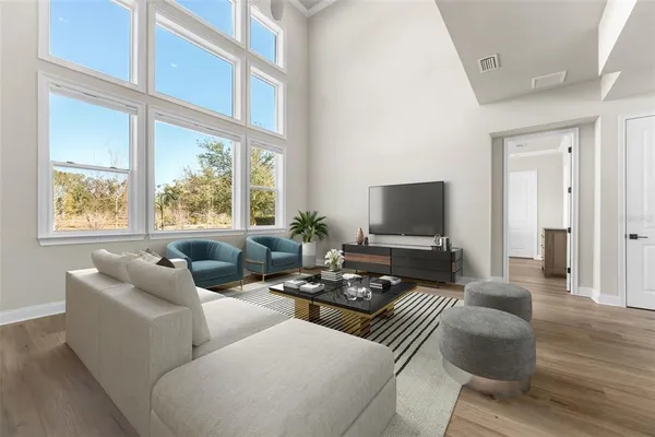 a kitchen with stainless steel appliances a sink a stove top oven a counter space and cabinets