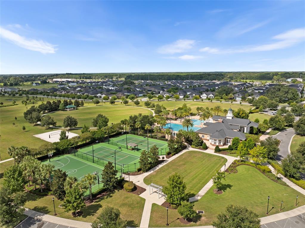 10778 Southwest 34th Road Gainesville, FL 32608 - Photo 54 of 55 an aerial view of residential houses with outdoor space