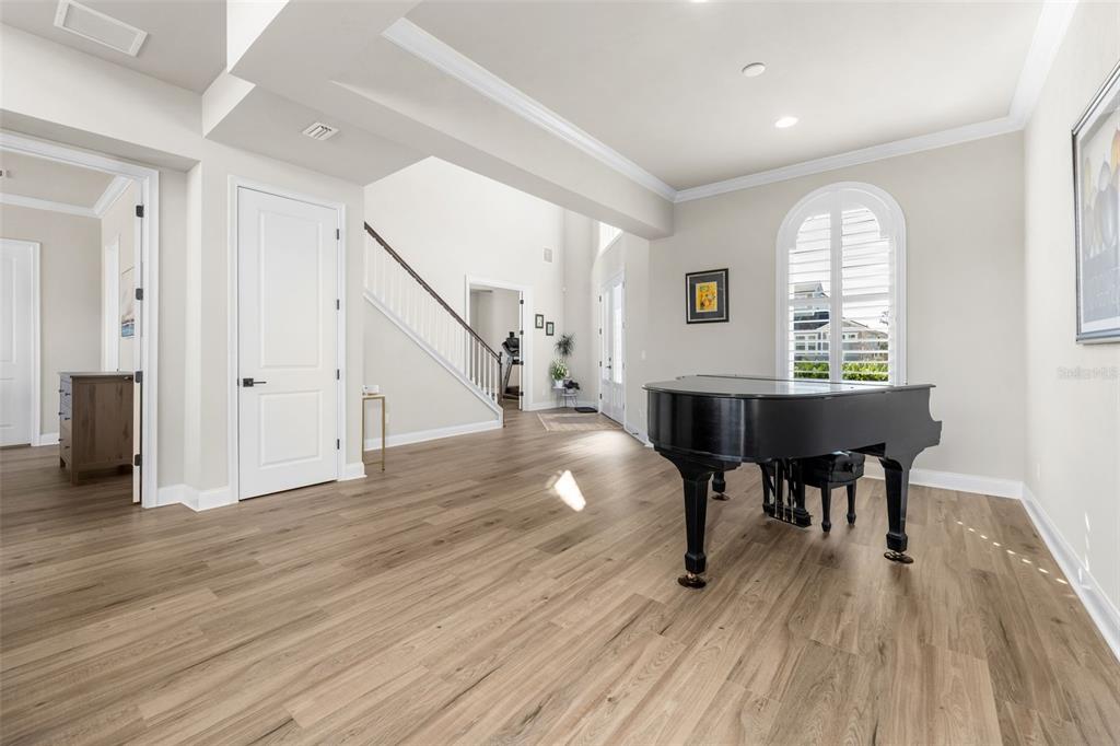 10778 Southwest 34th Road Gainesville, FL 32608 - Photo 8 of 62 a view of a livingroom with furniture wooden floor and windows